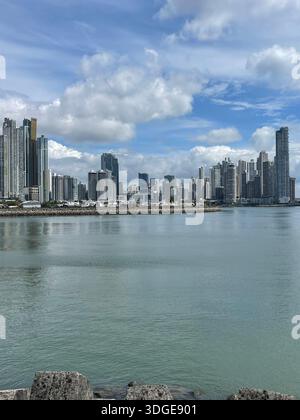 Skyline of Panama City reflected on the calm waters of the Pacific Ocean, Panama Stock Photo