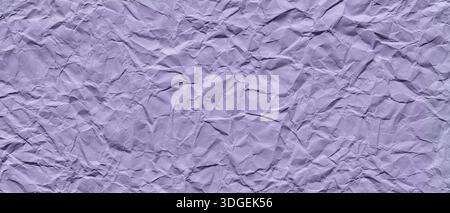 Crumpled Purple Paper Texture with Wrinkles and Creases Abstract Background Stock Photo