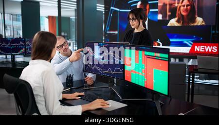 Hardworking Stock Traders Analyzing Investment Accounts At Financial Broker Desk Stock Photo
