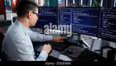 Hispanic Programmer Developing Data Analysis Software For Business On Computer. Stock Photo