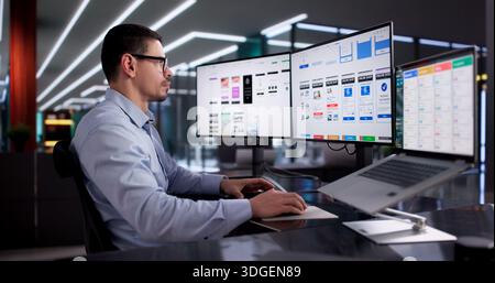 Young Latino Man Designing User Interface For Marketing Business Website Stock Photo
