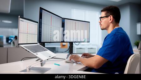 Hispanic Medical Billing Auditor Using Spreadsheet To Monitor Healthcare Data Stock Photo