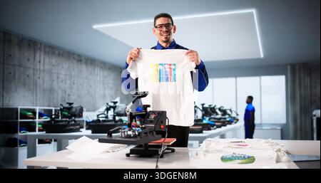 Custom Shirt Design: Latino Worker Using Heat Press Transfer Machine Stock Photo