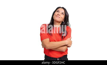 Happy dreamy woman looking up hugging herself Stock Photo