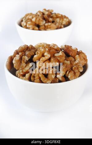 A bowl of peeled walnuts Stock Photo