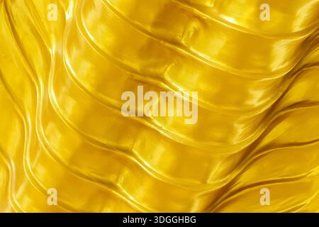 wavy gold texture for background and design. Stock Photo