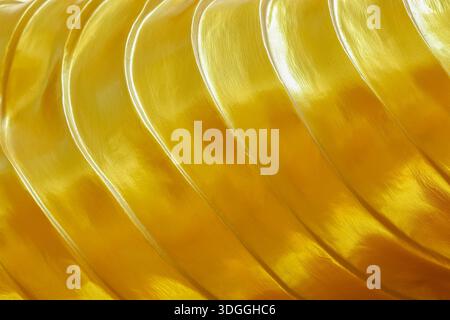 wavy gold texture for background and design. Stock Photo
