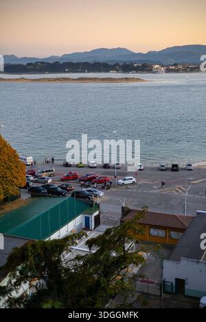Santander, Spain – Nov 19, 2021: A high-angle view of the waterfront and a parking lot in Santander, looking across the bay at sunset. Stock Photo