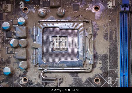 dirty processor slot on the motherboard of the computer Stock Photo