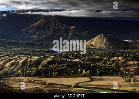 Breathtaking views from Coronet Peak with majestic mountains and dramatic clouds, Queenstown, Otago, New Zealand Stock Photo
