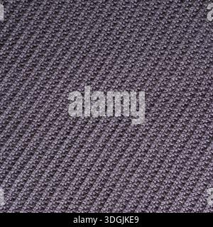 Closeup of industrially knitted cotton fabric of purple taupe color. Textured unicolor background. Stock Photo