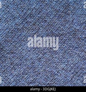 Closeup of industrially knitted wool fabric of blue color background Stock Photo