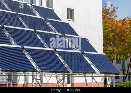 Solar thermal evacuated tubes to heat water on tile roof of large ...