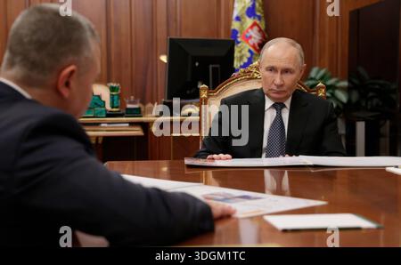 Moscow, Russia. 13 January, 2026. Russian President Vladimir Putin, right, listens to Yaroslavl Region Governor Mikhail Yevrayev, left, deliver his report during a face-to-face meeting at the Kremlin, January 13, 2026 in Moscow, Russia.  Credit: Mikhail Metzel/Russian Government/Alamy Live News Stock Photo
