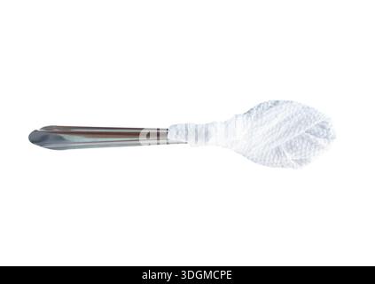 A silver teaspoon wraped with white tissue paper is isolated on white background with clipping path. Stock Photo