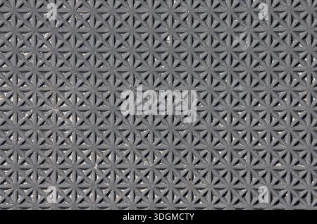 Textured surface with a repeating geometric pattern abstract background Stock Photo
