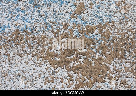 Weathered and chipped white, brown and blue surface close-up abstract textured background Stock Photo
