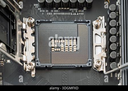 Close-Up of a CPU Socket on a Modern Computer Motherboard, Ready for Processor Installation Stock Photo