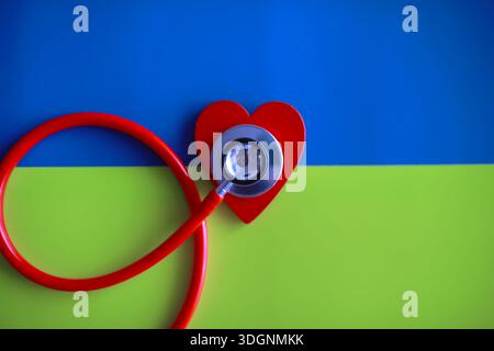 Doctor at his desk in the clinic's office. Stethoscope, test tubes, laptop, prescriptions, glasses on table. Stock Photo