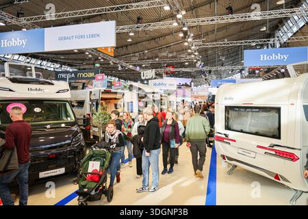 25 January 2026, Baden-Württemberg, Sulzbach an der Murr: A man pushes ...