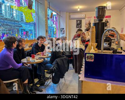 Paris, France, Group People, Women, Sharing Coffee inside Parisian Cafe LGBTQI+ Bookstore, "Violette and Co. » (Oberkampf) small independent books Stock Photo