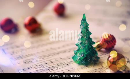 Christmas Sheet Music. Christmas decorations on music sheets Stock Photo