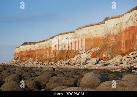 Hunstanton cliffs, Norfolk. Eroded cliffs displaying red and white layers of carstone and chalk stratifications on the North Norfolk coast. SSSI Stock Photo
