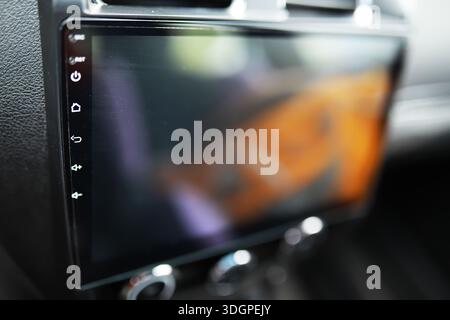 The process of choosing climate control in the car. Man regulating temperature on car air condition. Modern car interior Stock Photo