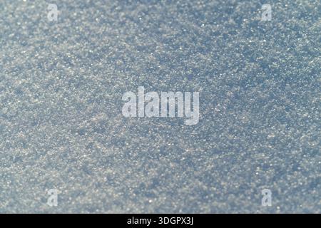 Macro snow crystal texture, microscopic detail reveals glittering facets, cool blue tint, high fidelity surface ideal for science, education and textu Stock Photo