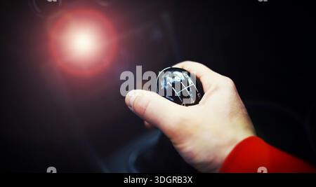 Close up view of a gear lever shift. Manual gearbox. Car interior details. Car transmission. Soft lighting. Stock Photo