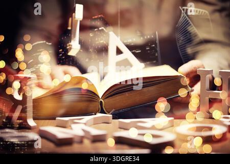 Close up of an unrecognizable man holding a book standing against a morning city panorama. Mock up, toned image, double exposure Stock Photo