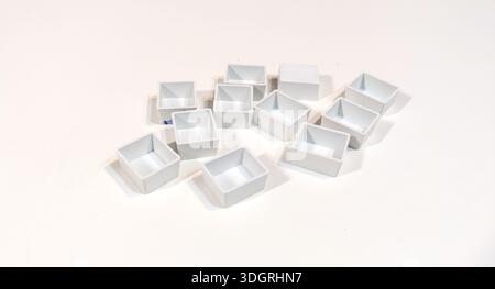 New empty white cuvettes for watercolor paints isolated on white background. Art supplies collection for painting. Back to school. Art supplies for dr Stock Photo