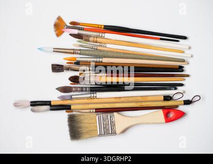 Different watercolor brushes collection isolated on white background, art supplies collection for painting, different sizes and shapes. Back to school Stock Photo