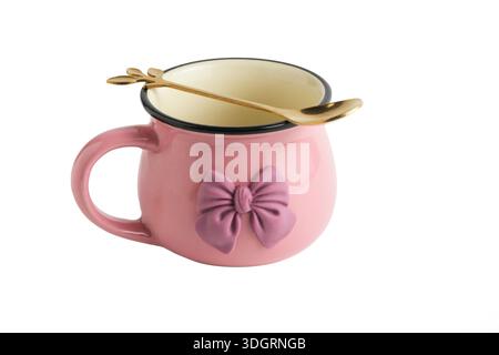 Pink mug with bow on white background, isolated object Stock Photo