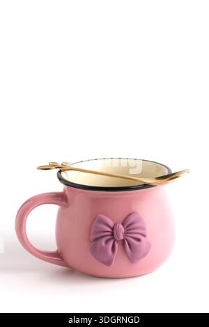 Pink cup with pink bow isolated on white background Stock Photo