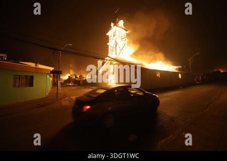 Concepcion, Chile. 28th Jan, 2026. Concepción, Chile - January 18, 2026: A church burns after being engulfed by a wildfire in the Bio Bio province. A tragic preliminary toll confirms one death and 253 homes destroyed following uncontrolled wildfires in the commune. Driven by strong winds overnight, the flames rapidly reached urban sectors, also affecting the neighboring towns of Penco and Lirquén. Emergency crews are struggling to contain the disaster in the Biobío region as the fire consumes residential areas. (Photo: Carlos Acuña/ATON/UNAR AGENCY) Credit: Sipa USA/Alamy Live News Stock Photo