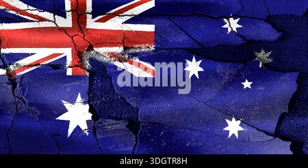Australia flag painted on a cracked surface representing national challenges and damage Stock Photo