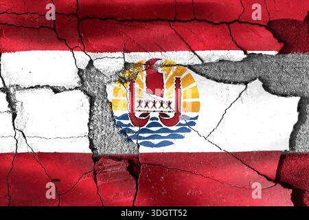 French Polynesia flag painted on a cracked and damaged concrete wall reflecting political struggle Stock Photo