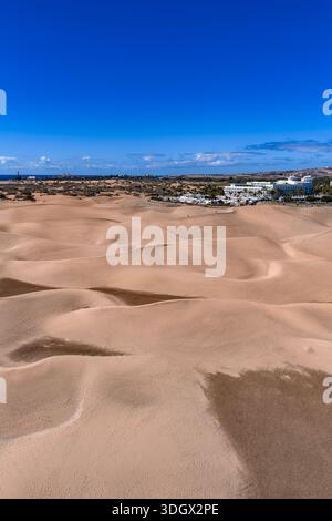 Aerial over Maspalomas Dunes Reserve, Gran Canaria, Atlantic and lighthouse Stock Photo