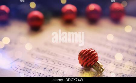 Christmas Sheet Music. Christmas decorations on music sheets Stock Photo
