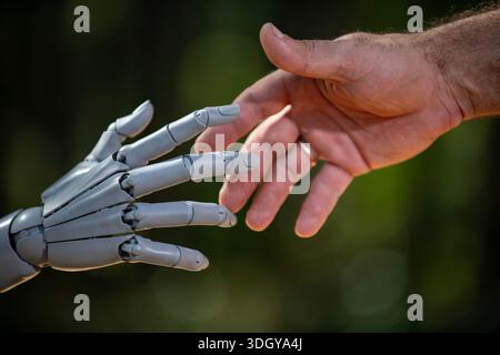 Robot human handshake humanity ai. Robot human handshake android humanoid. Robot human handshake digital bioengineering. Robot human handshake biotech Stock Photo