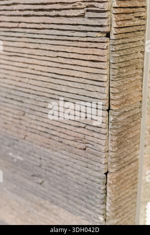 A collection of decorative cement plates is stacked neatly in a workshop. Each plate shows unique patterns and textures that highlight the Stock Photo