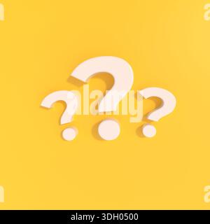 White 3d question marks standing on a bright yellow background, symbolizing questions, query, and problem-solving concepts Stock Photo