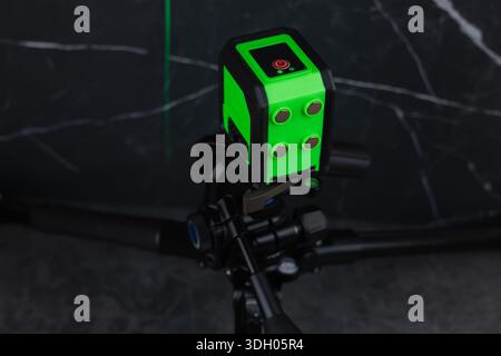 Construction laser level in a building under construction. Laser equipment at a construction site. Stock Photo