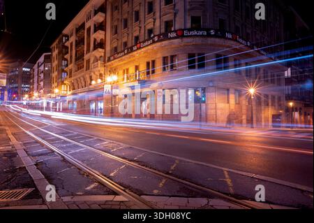 light trails from passing cars and Basque language banners. Stock Photo