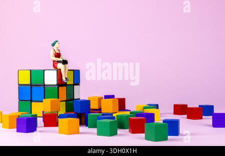 Woman Sitting on Colorful Blocks Digital Life Technology Concept Stock Photo