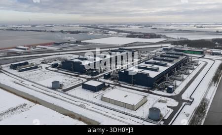 Aerial view of large, modern buildings contrasting against the stark white snow-covered landscape, Datacenter, Noord-Holland, Netherlands. Stock Photo