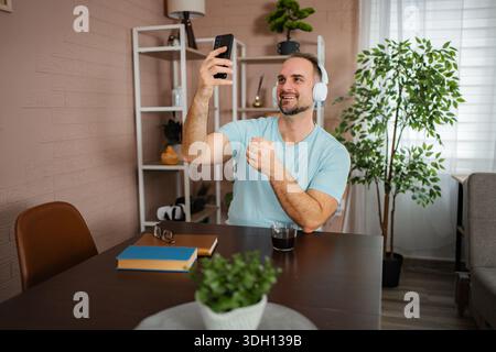 Man learning sign language during video call communication Stock Photo