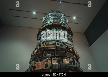Large tower of old radios, artfully stacked in space, Tate Modern of Art, Lodon, United Kingdom Stock Photo