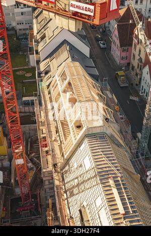 Close-up of construction work on a roof with workers in an urban environment, carpentry, renovation, roof extension, Stuttgart, Germany Stock Photo